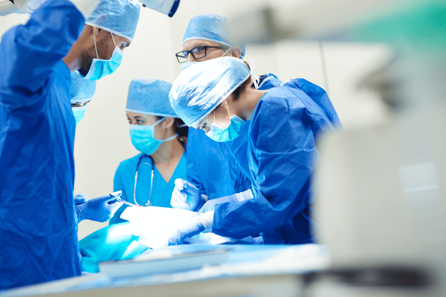 A team of surgeons performing scarless gallbladder removal surgery at University Surgical